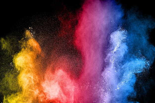 Premium Photo | Multicolored powder explosion on black background.