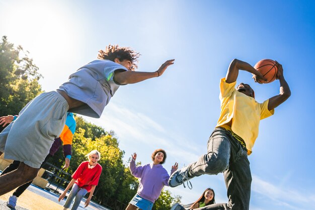 Premium Photo | Multicultural group of young friends bonding outdoors ...