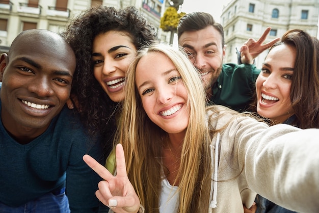 Multiracial group of young people taking selfie Photo | Free Download