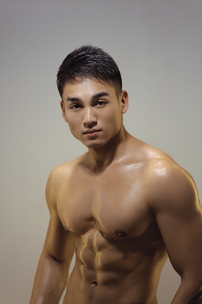 Asian muscle indoor posing