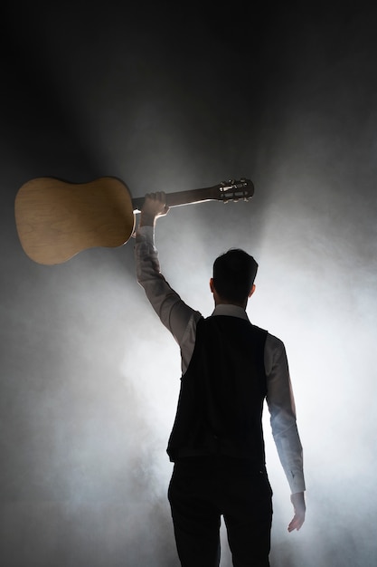 Free Photo | Musician on stage holding his classical guitar