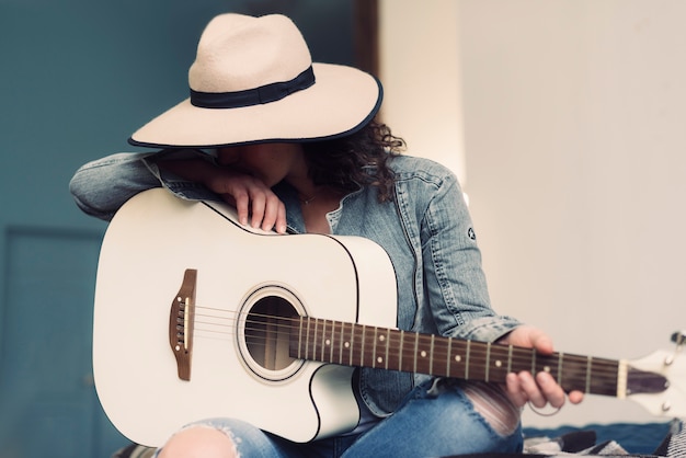 Free Photo Musician With Hat And Guitar 9381