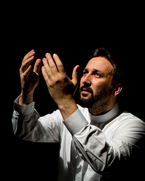 Premium Photo | Muslim man praying for god in dark room at ramadan