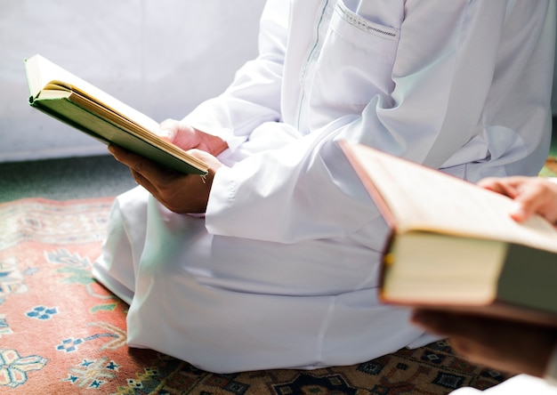 Premium Photo | Muslim men reading quran during ramadan