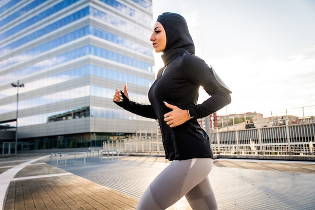 Premium Photo | Muslim sportive girl with fit body training outside