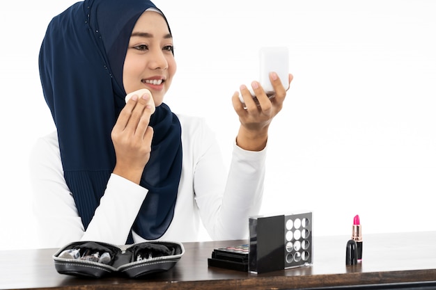 Premium Photo  Muslim using make up