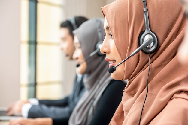 muslim woman working as customer care operator with team call center 8087 2053 - Waspada Penipuan! Ini Aplikasi BPJSTK yang Asli dan Aman