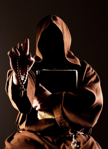 Premium Photo | Mystery preaching monk with bible