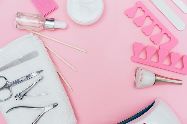 free-photo-nail-care-accessory-tools-copy-space-pink-background