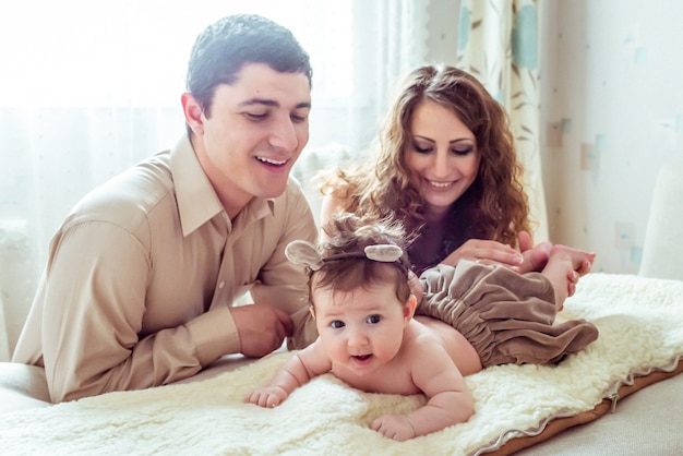 Premium Photo Naked Baby With Her Parents