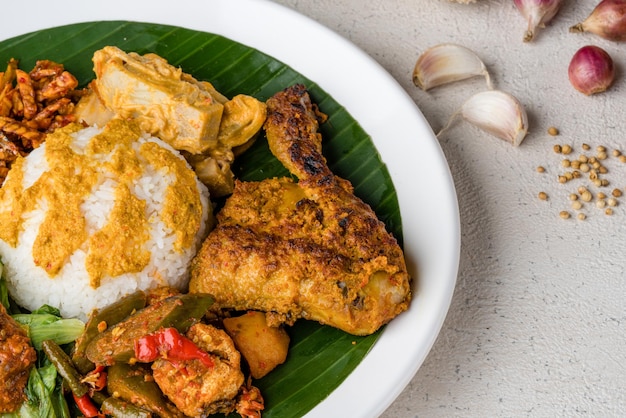 Premium Photo | Nasi Padang With Chicken Rendang Is An Indonesian Food ...