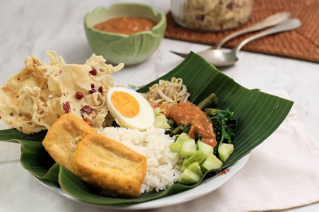 Premium Photo | Nasi pecel. traditional javanese rice dish of steamed ...