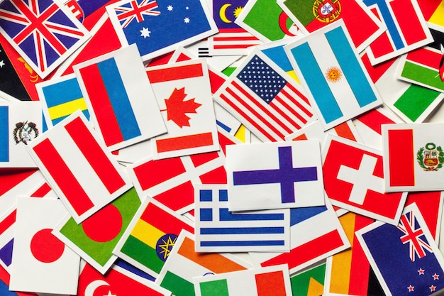 National flags of the different countries of the world in a scattered heap , Premium Photo