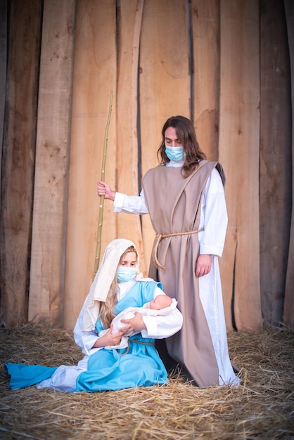 Premium Photo | Nativity scene with the characters wearing facial masks