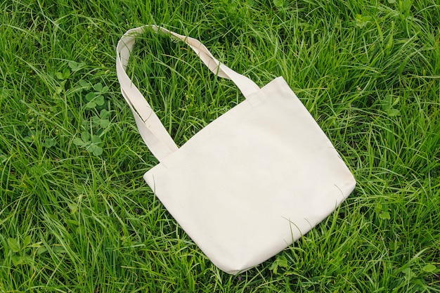 Download Premium Photo | Natural eco bag, mockup on a wall of green grass, top view.