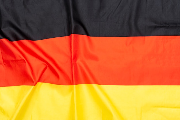ドイツまたはドイツの旗の天然生地しわくちゃの旗 プレミアム写真