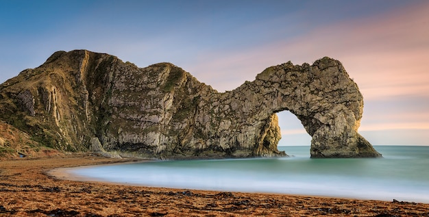 Premium Photo | Natural Limestone Arch On Jurassic Coastline Of Dorset ...