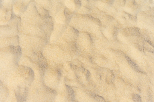 Premium Photo | Nature of texture sand on beach in sun light as background.