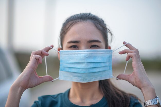 Premium Photo | New normal woman wearing a dust mask and corona virus ...