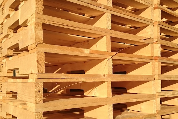 New wooden pallets is stack in the warehouse of cargo delivery enterprise. Premium Photo