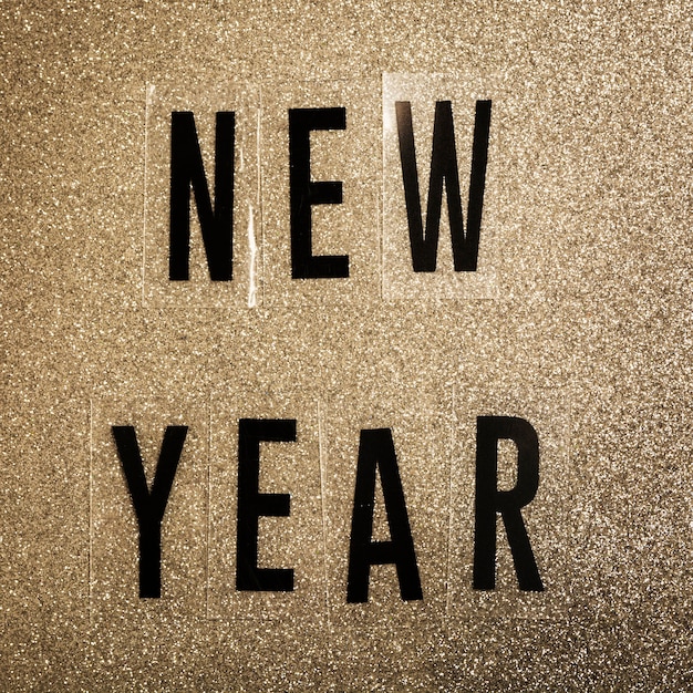 Free Photo | New year lettering on noise sepia background