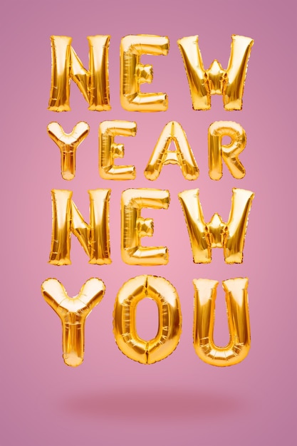 Premium Photo New Year New You Phrase Made Of Golden Inflatable Balloons On Pink Background New Goal Concept