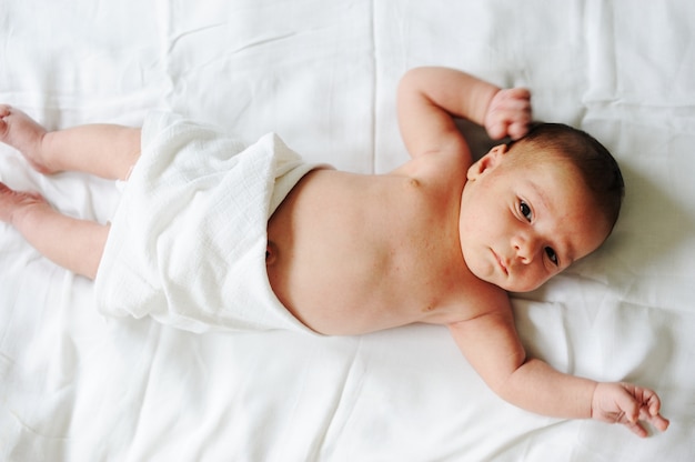 Premium Photo Newborn Baby Lying In His Bed