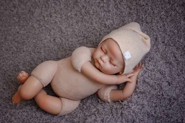 Premium Photo Newborn Baby Mannequin Close Up For Practicing In Newborn Photography