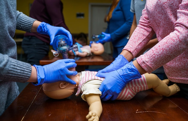 Premium Photo | Newborn resuscitation on a infant dummy doll. first ...