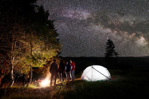 Premium Photo Night Camping In The Forest Under A Magical Sky With Lots Of Bright Stars And Milky Way On Hills