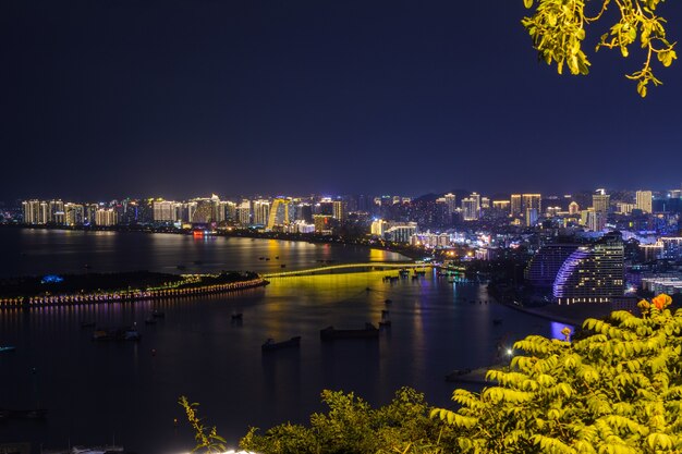 Premium Photo | Night view of sanya city with bright multi-colored ...