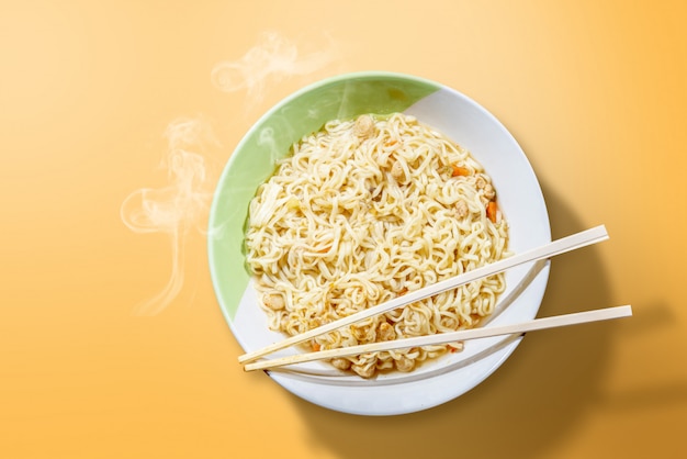 Premium Photo | Noodles on the bowl with chopstick