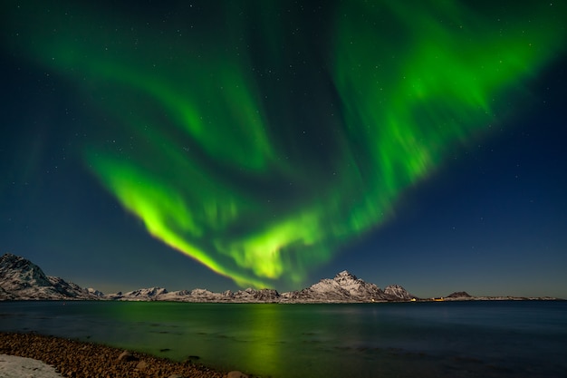 Premium Photo Northern Lights Aurora Borealis With Mountains In Background Over Senja Norway