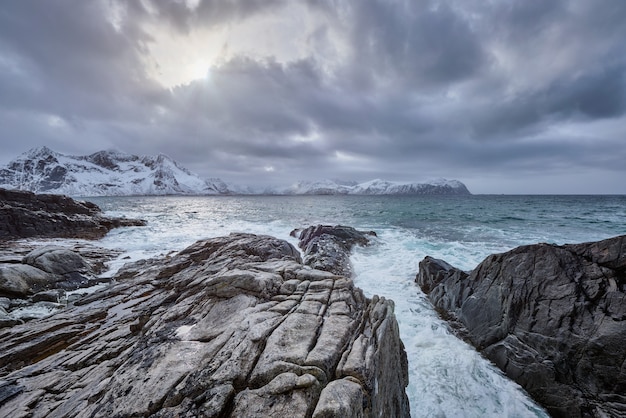 Premium Photo | Norwegian sea waves on rocky coast of lofoten islands ...