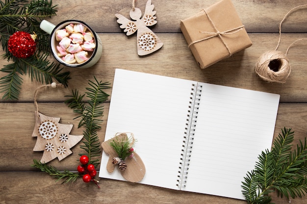 Notebook Mock Up Surrounded By Christmas Decorations Free Photo