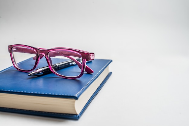 Premium Photo Notebook With Glasses And Pen Book With Glasses Blue Notebook With Glasses