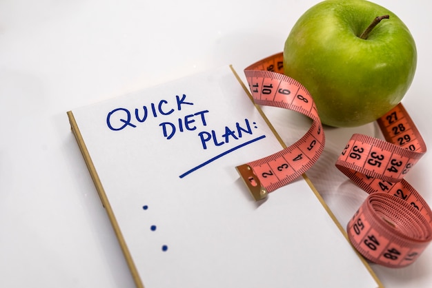 The notepad with diet plan list text. healthy lifestyle ...