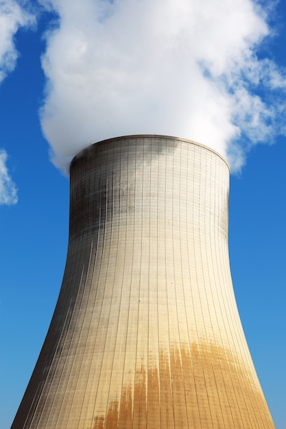 Nuclear power station cooling tower in blue sky Free Photo