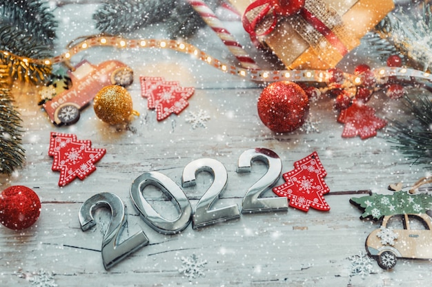 Christmas In Woods 2022 Premium Photo | Numbers 2022 On A Wooden Background With Christmas  Decorations And Snowflakes