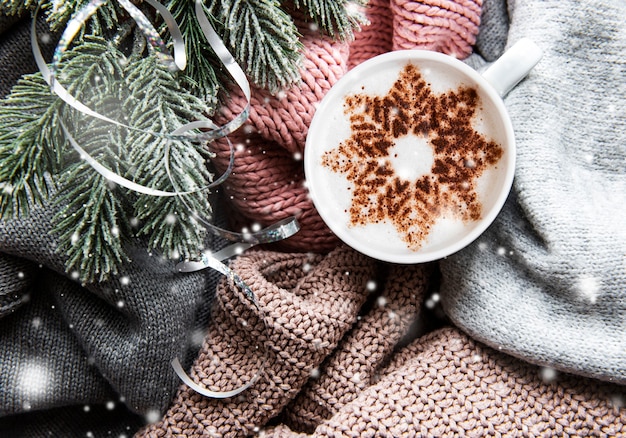Premium Photo D Offee With A Snowflake Pattern On A Warm Knitted Sweaters Surface