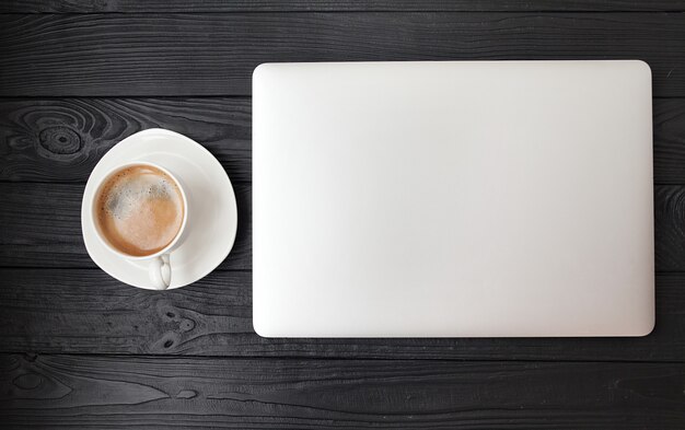 Premium Photo | Office desk - laptop computer and coffee cup on wood ...