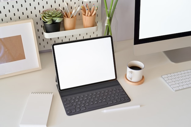 Office desk scenery with mockup blank screen laptop computer. workspace minimal | Premium Photo