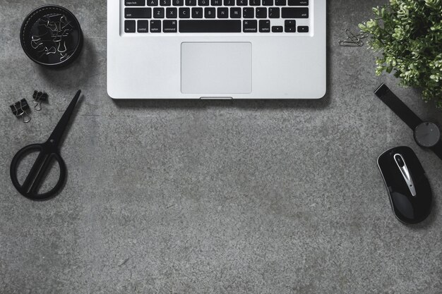 Office desk table with laptop,dark tone,top view with copy space Premium Photo