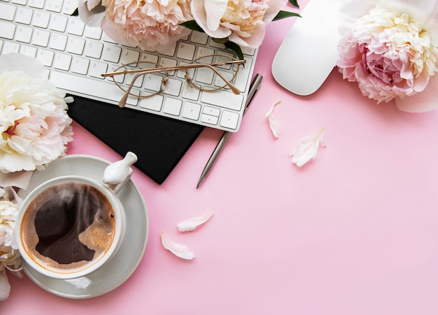 Premium Photo | Office desk with cup of coffee and peony flowers