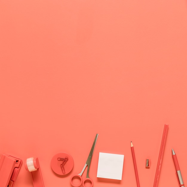 Office stationery on red background Free Photo