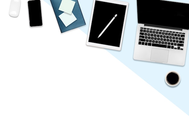 Office table with laptop computer, digital tablet, mobile phone and accessories. Premium Photo