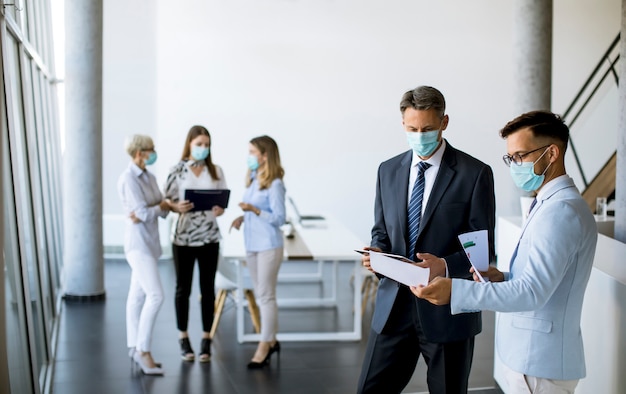 Premium Photo | Office workers have a meeting in the office with face ...