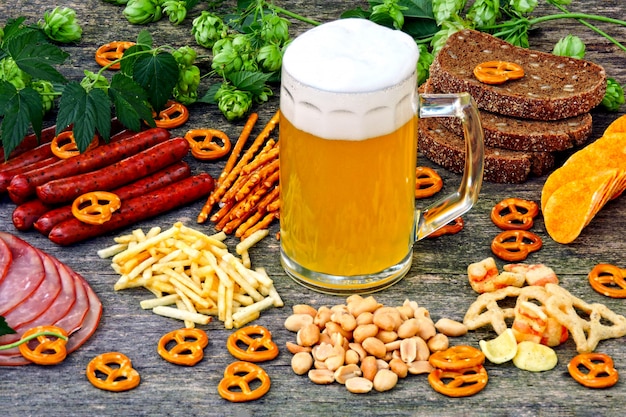 Oktober fest. glass of beer and beer snacks. Premium Photo
