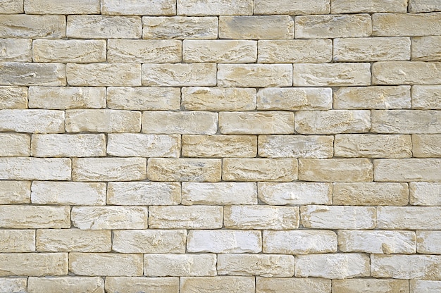 Old beige brick wall  texture Premium Photo