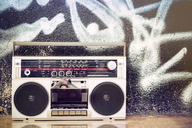 Premium Photo Old Boombox With Cassette On The Floor And On A Graffiti